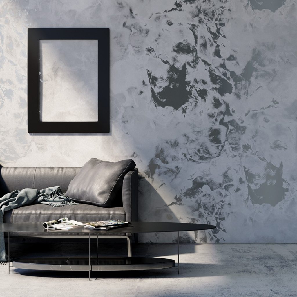 Fototapet Concrete Surfaces, YoYo Design, intr-o incapere cu rama de tablou neagra, canapea din piele neagra cu perna si patura, masa de cafea neagra pe care se afla reviste